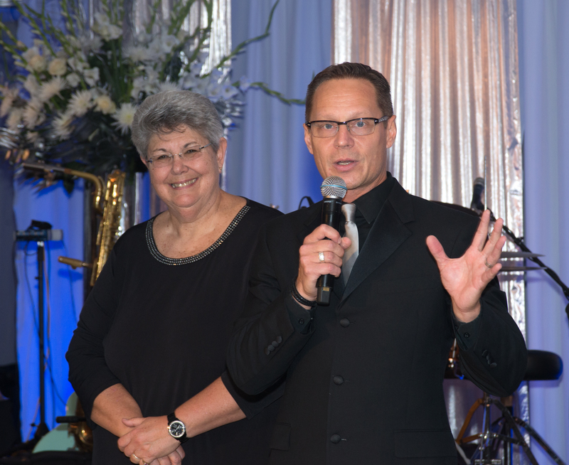 Committee member Natalie Moss listens as Co-chair Chris Beagle talks about preparing for the 25th Anniversary. BY DENY HOWETH